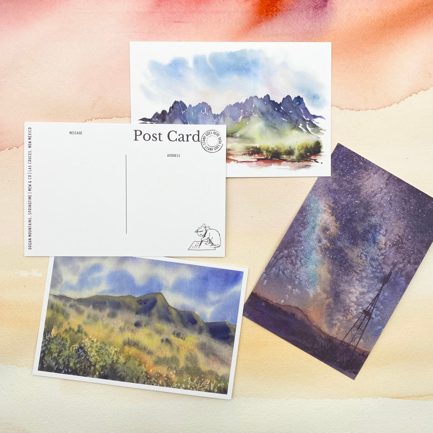 A collection of New Mexico postcards featuring original watercolor artwork.
